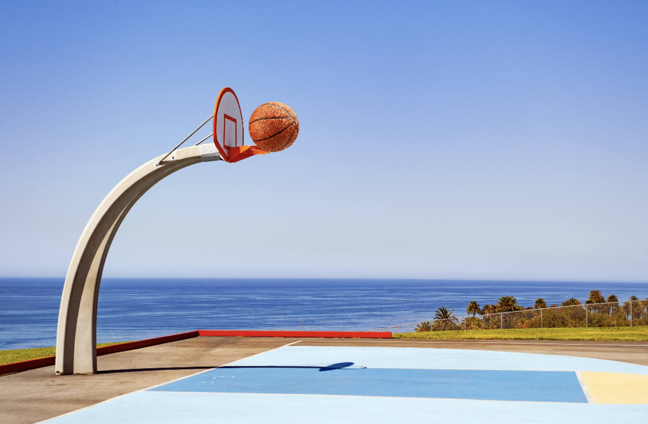 The image features the ball being moved closer to the hoop.