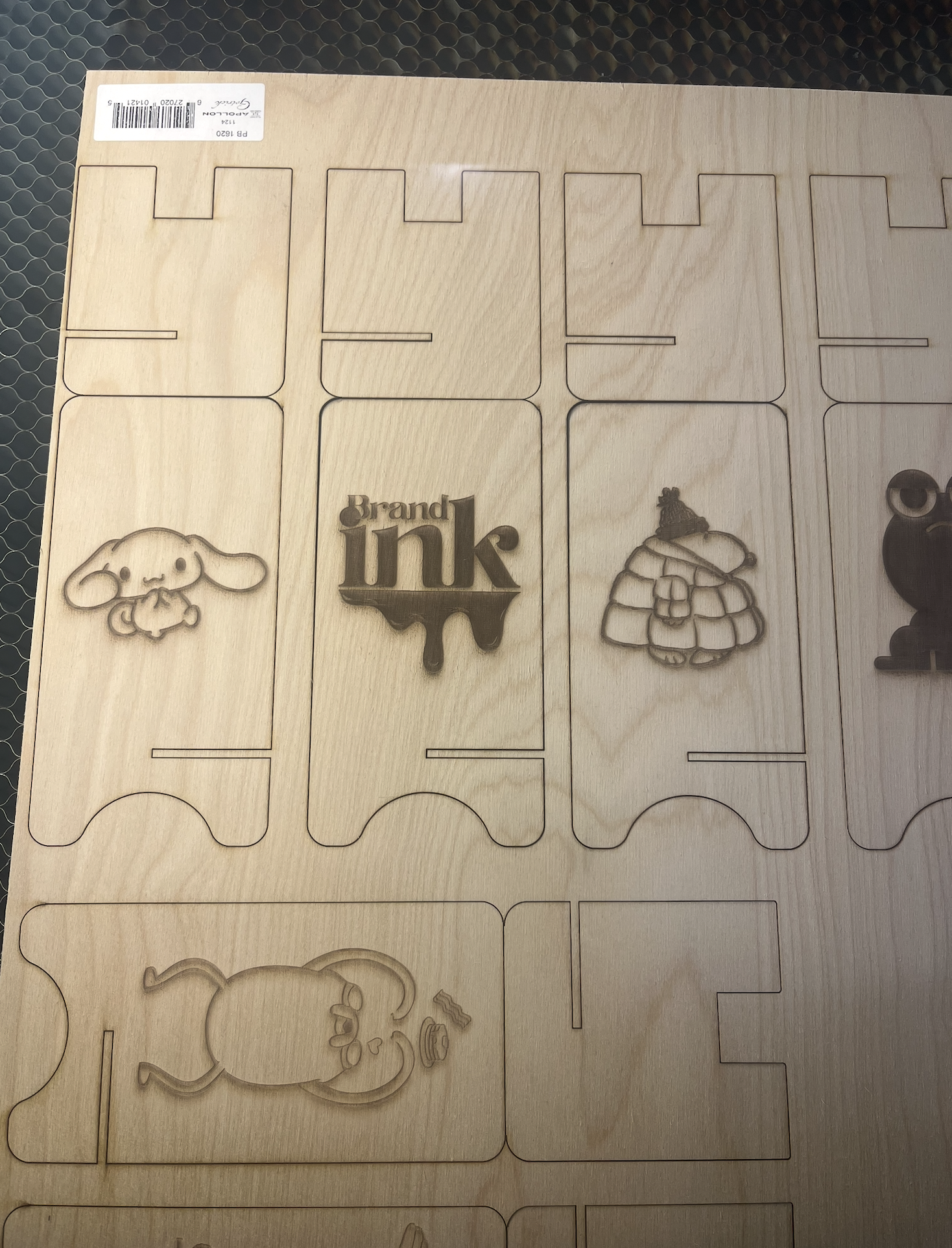 An image taken while working in a group to complete the laser cutting activity, the completed laser cut before separating the pieces.