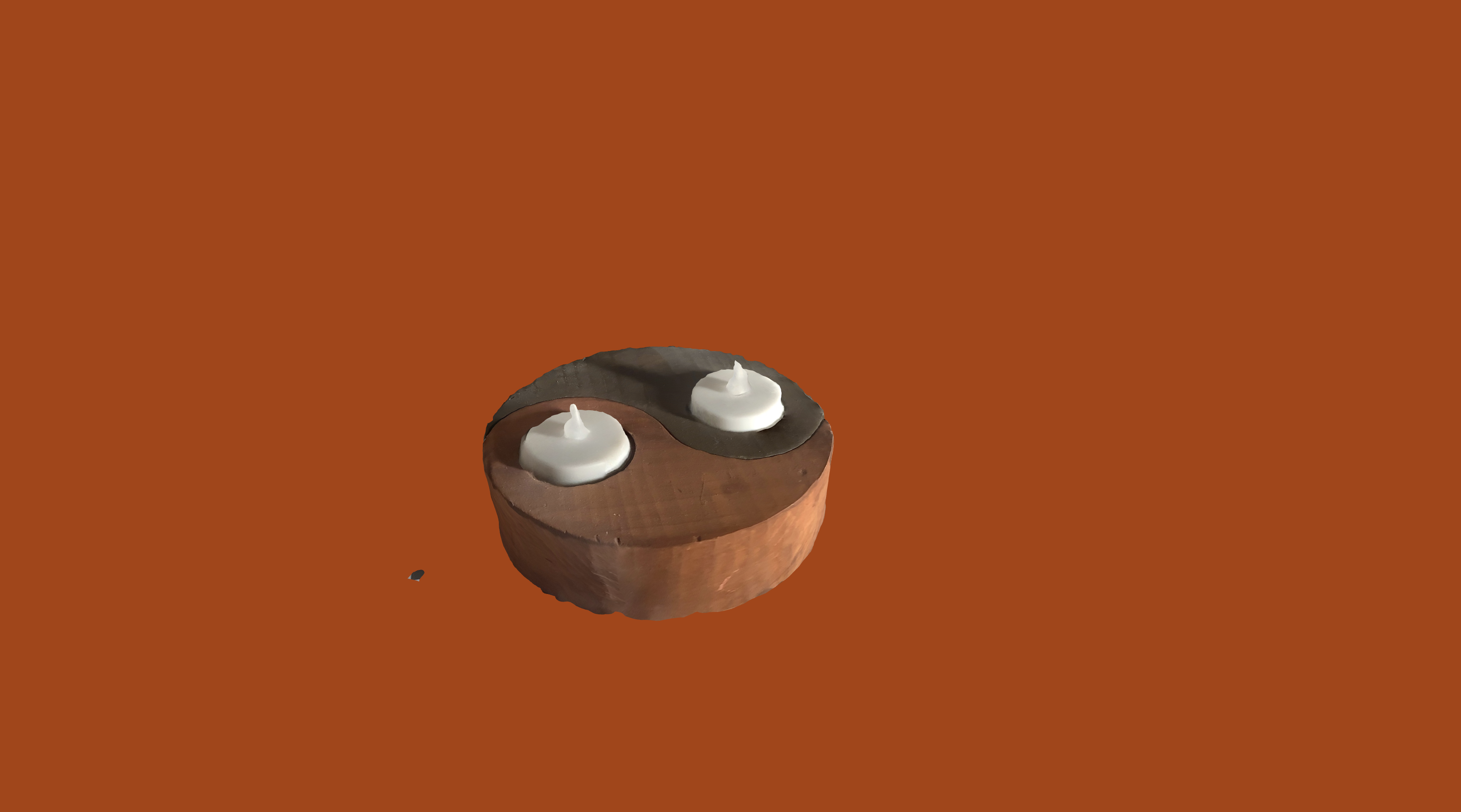 The candle 3D model on the live site with a deep orange background.