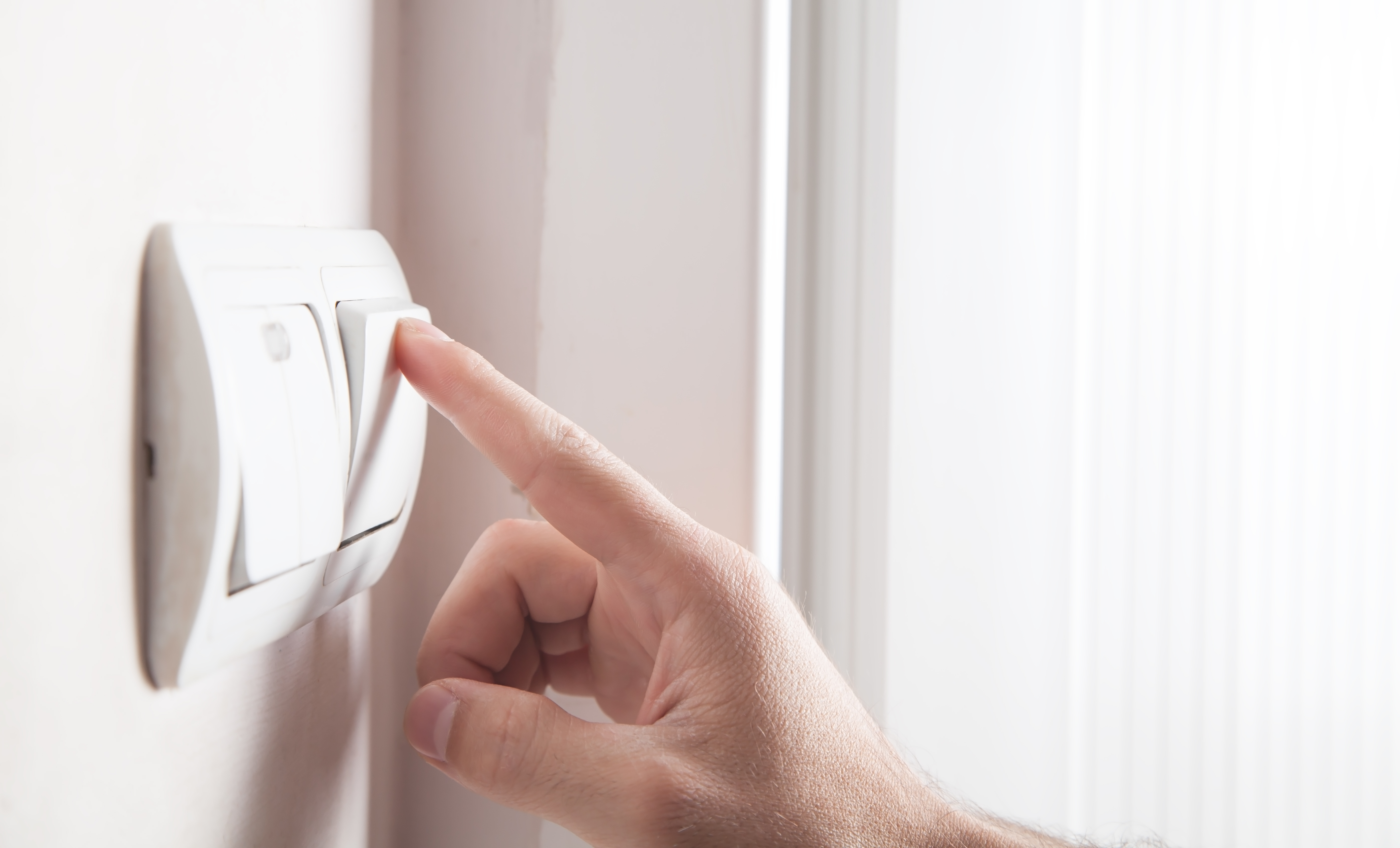 Turning a light switch on and off.